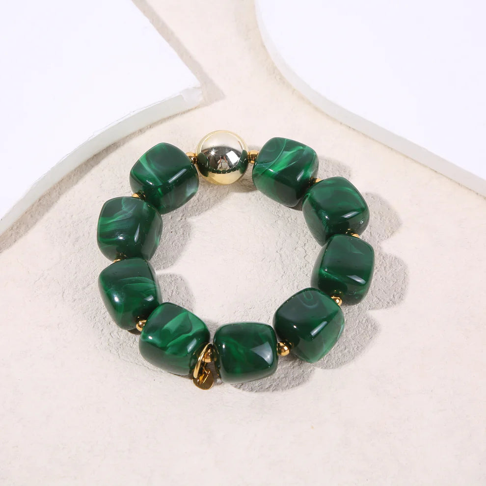 Bracelet élastique doré résine verte marbrée formes carrés
