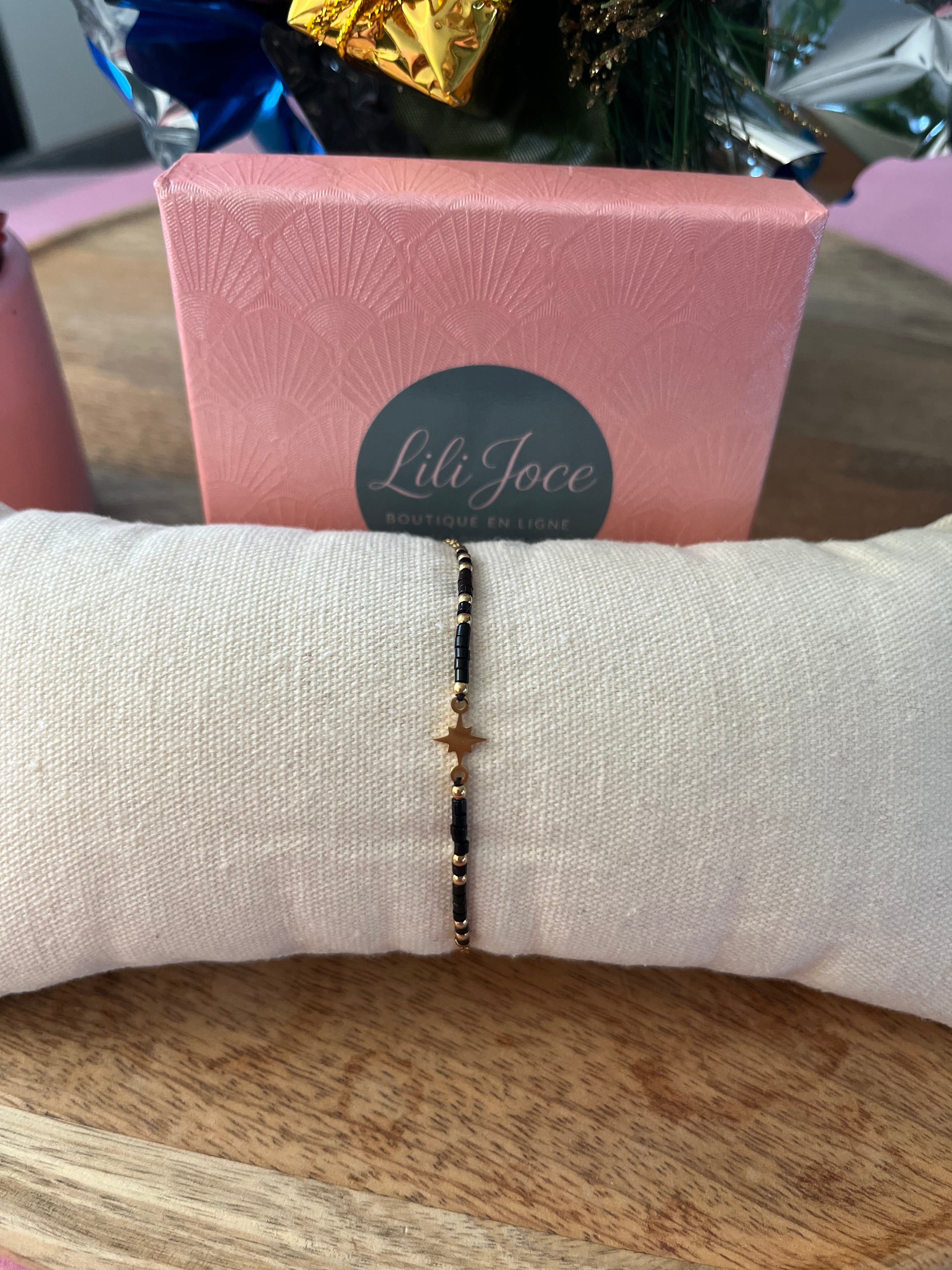 Bracelet doré et noir – Étoile centrale élégante