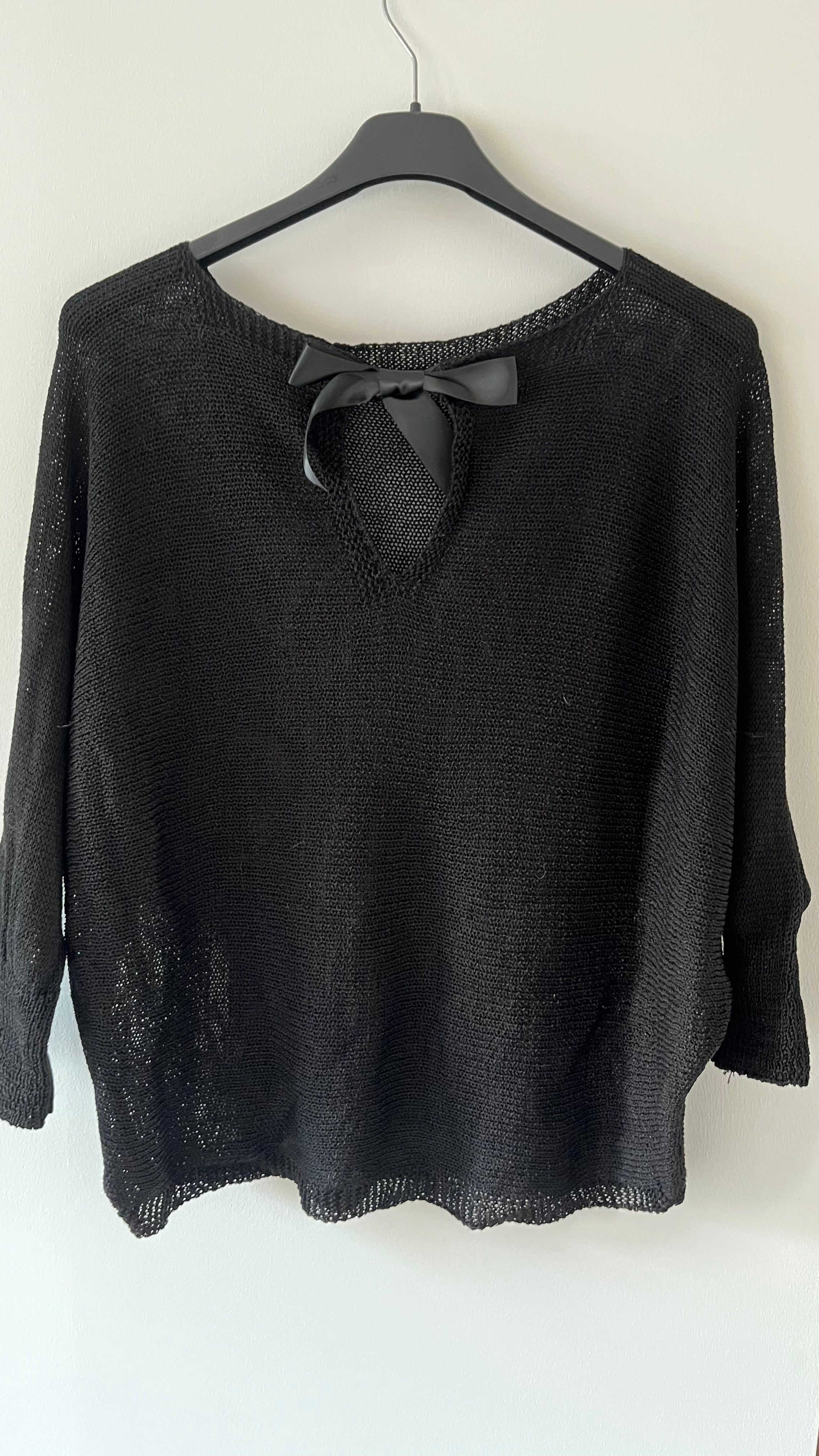 Pull maille fine avec nœud dos ouvert..