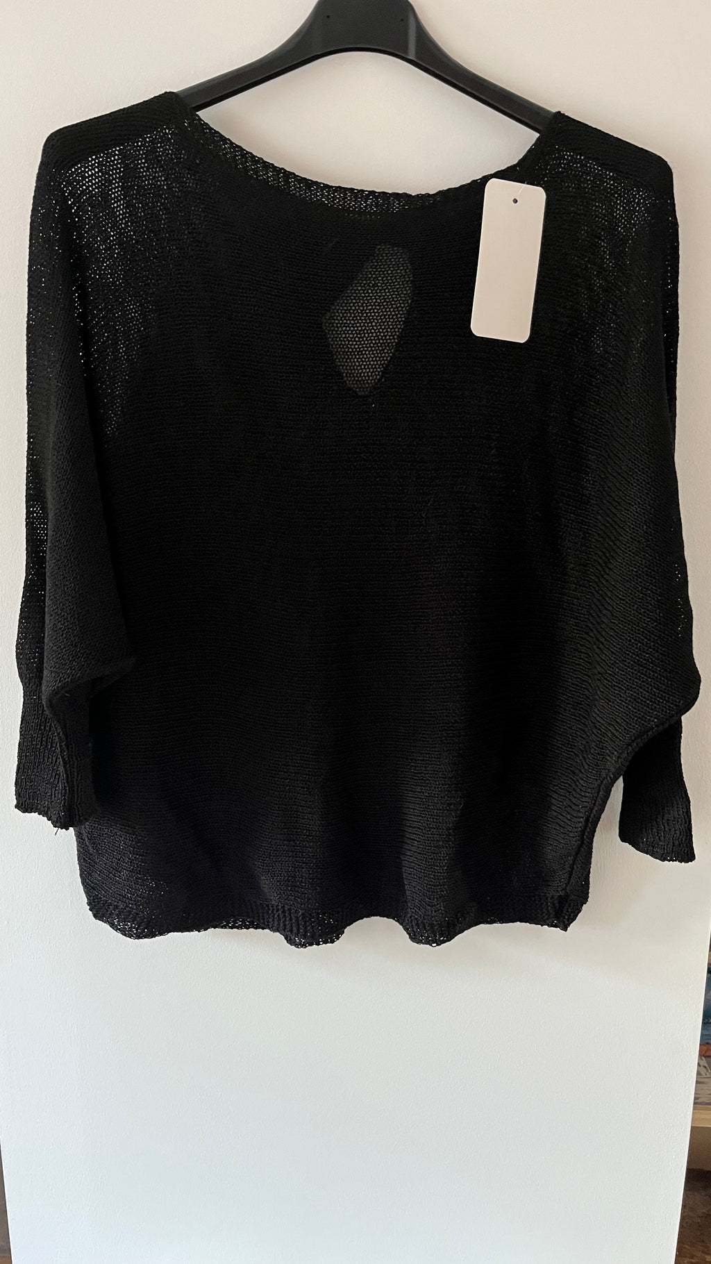 Pull maille fine avec nœud dos ouvert..