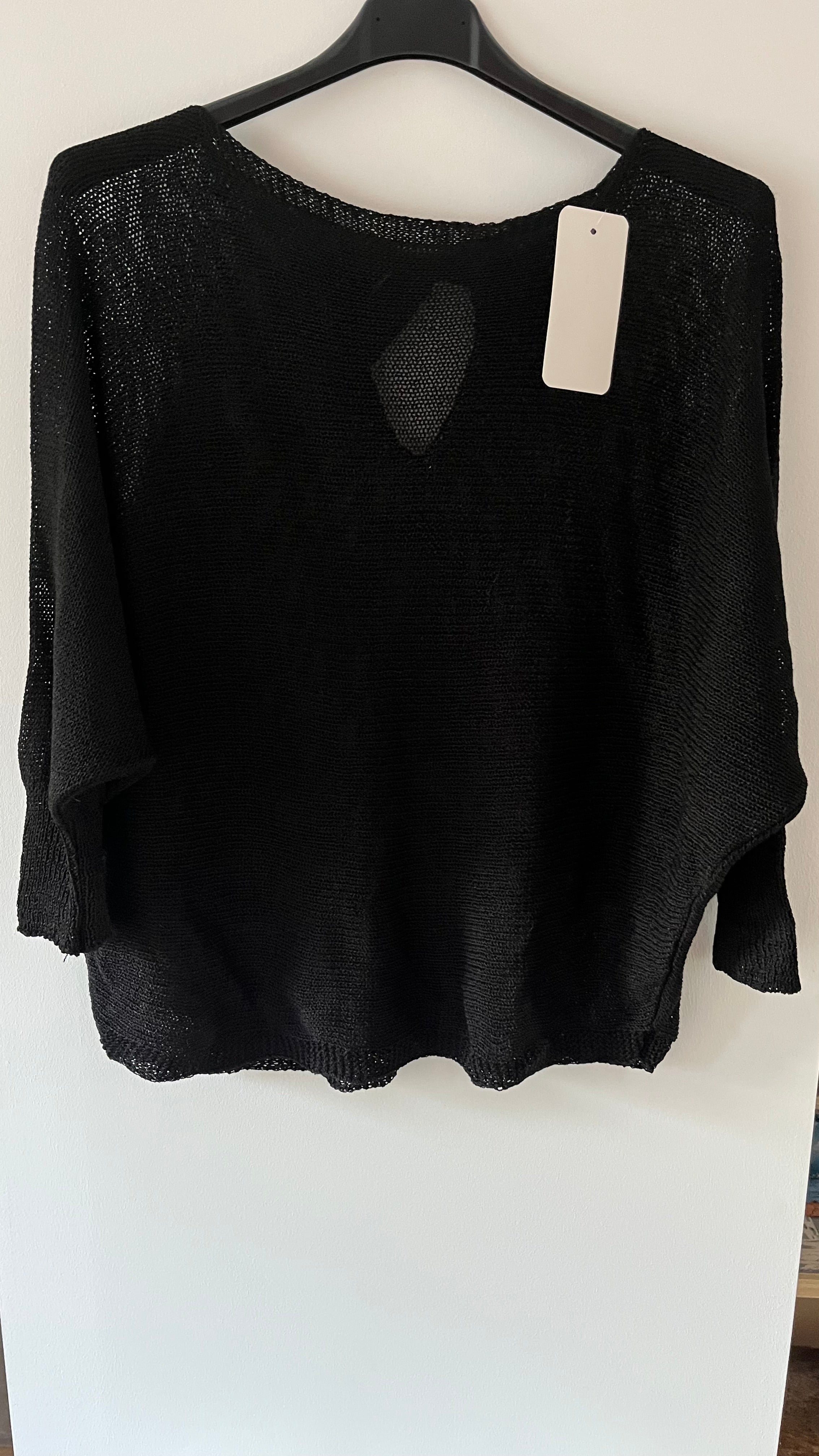 Pull maille fine avec nœud dos ouvert..