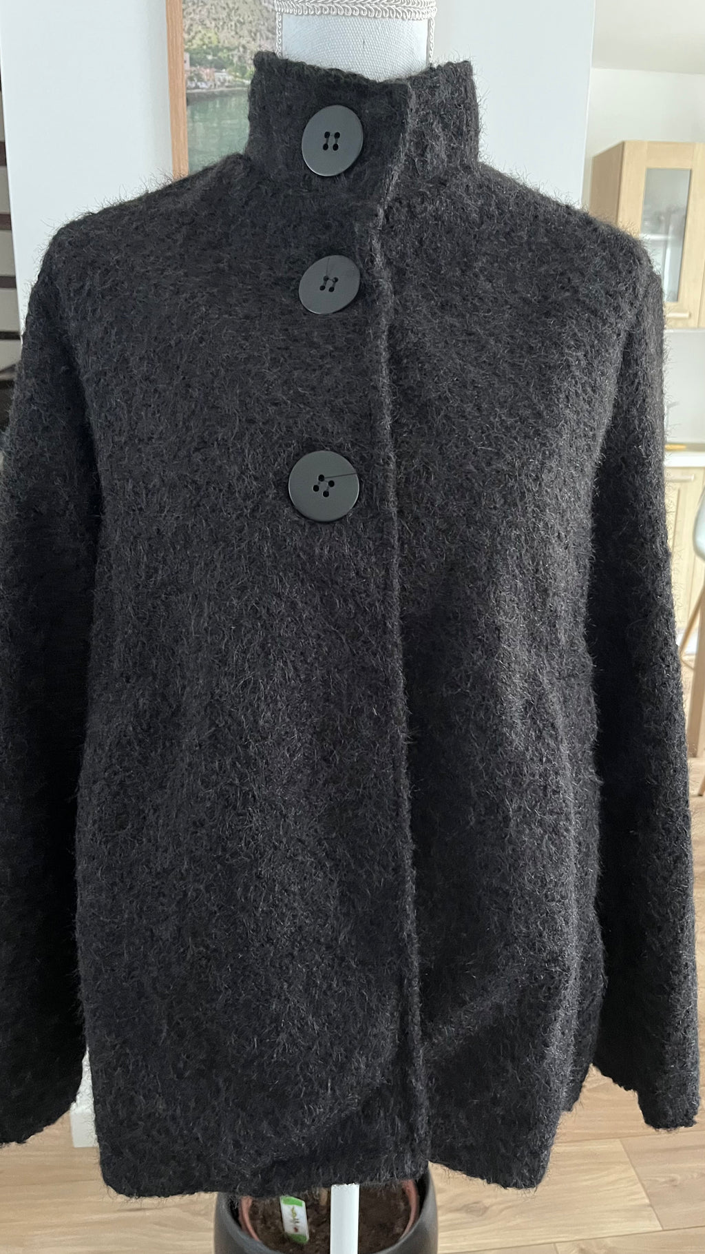 Veste style poncho en laine bouclée