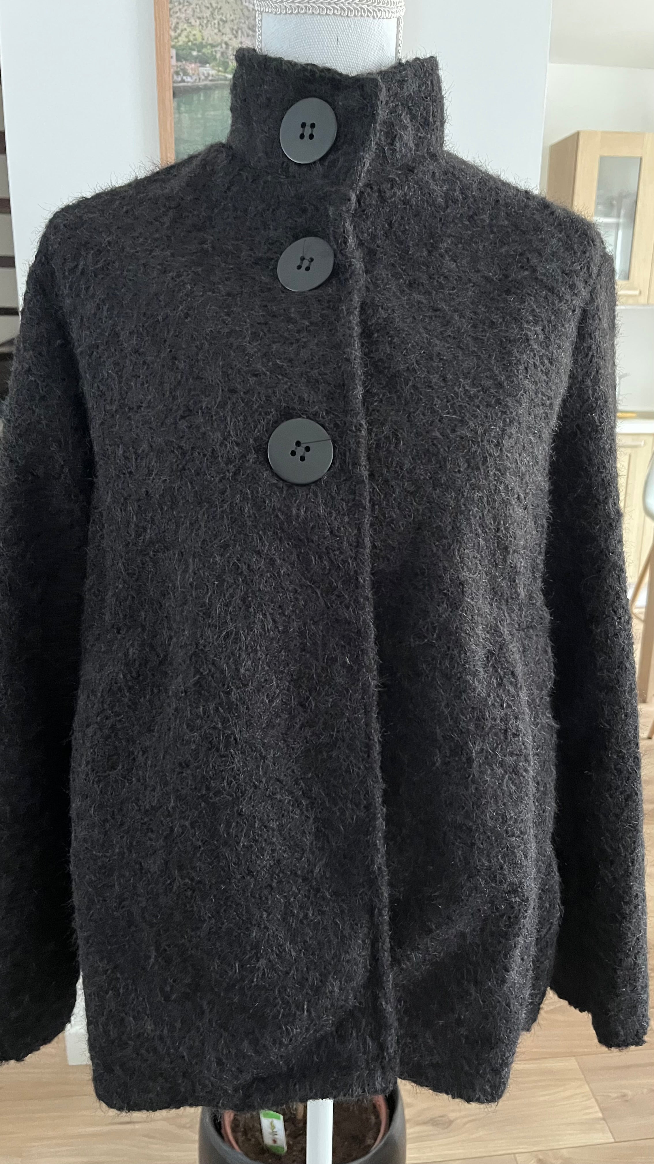 Veste style poncho en laine bouclée