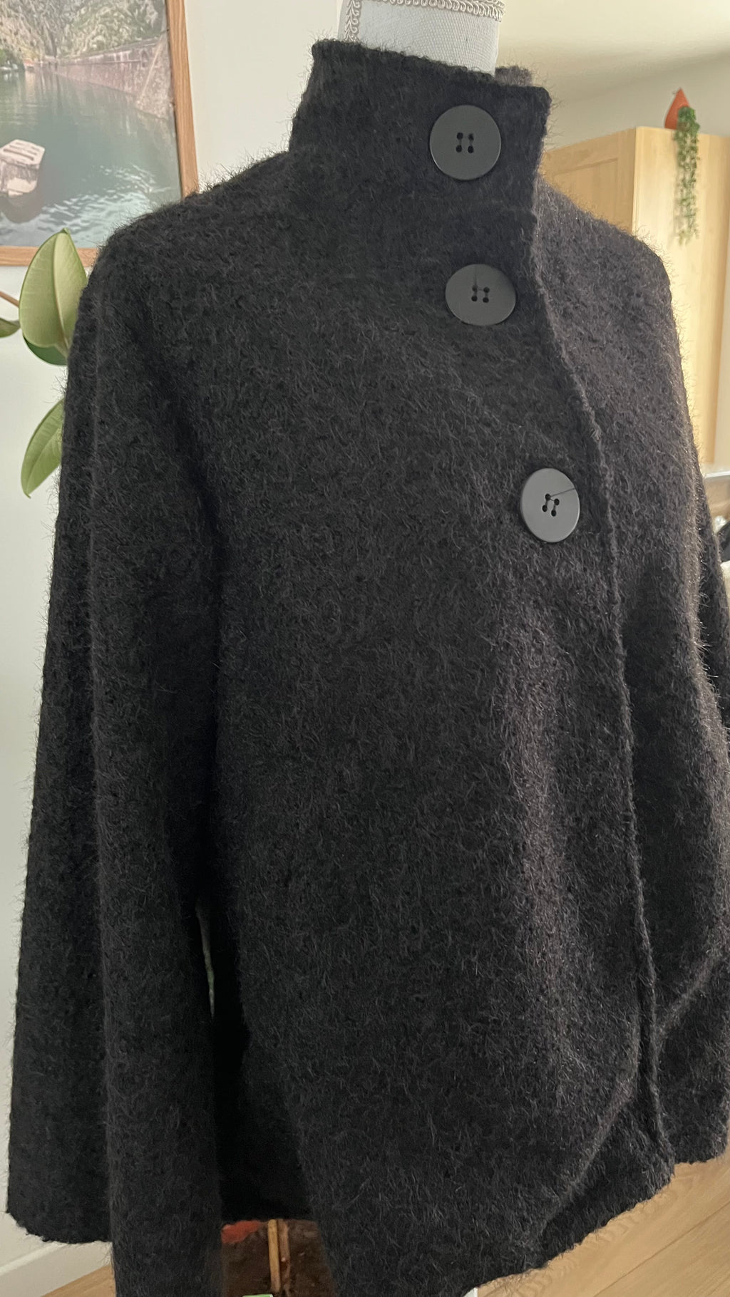 Veste style poncho en laine bouclée