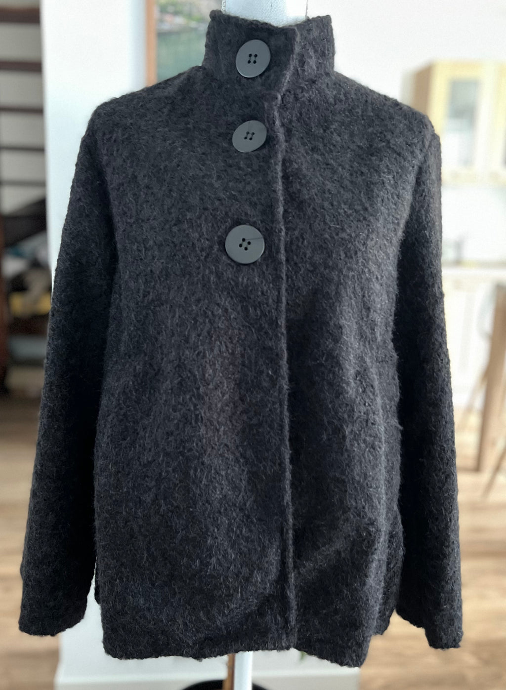Veste style poncho en laine bouclée