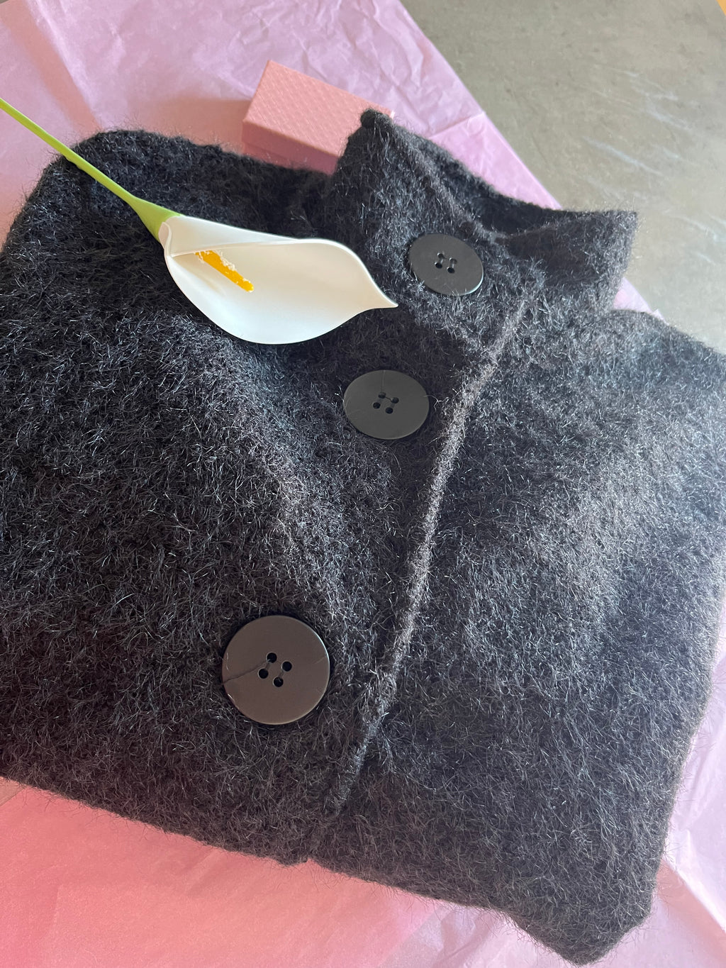 Veste style poncho en laine bouclée