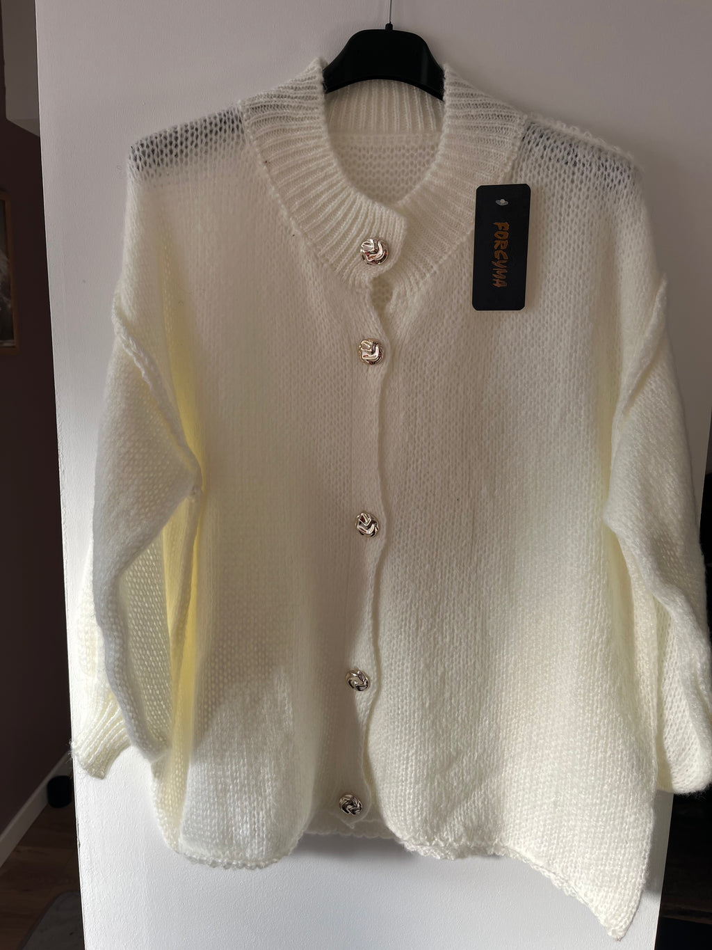 Gilet à col volanté et manches bouffantes