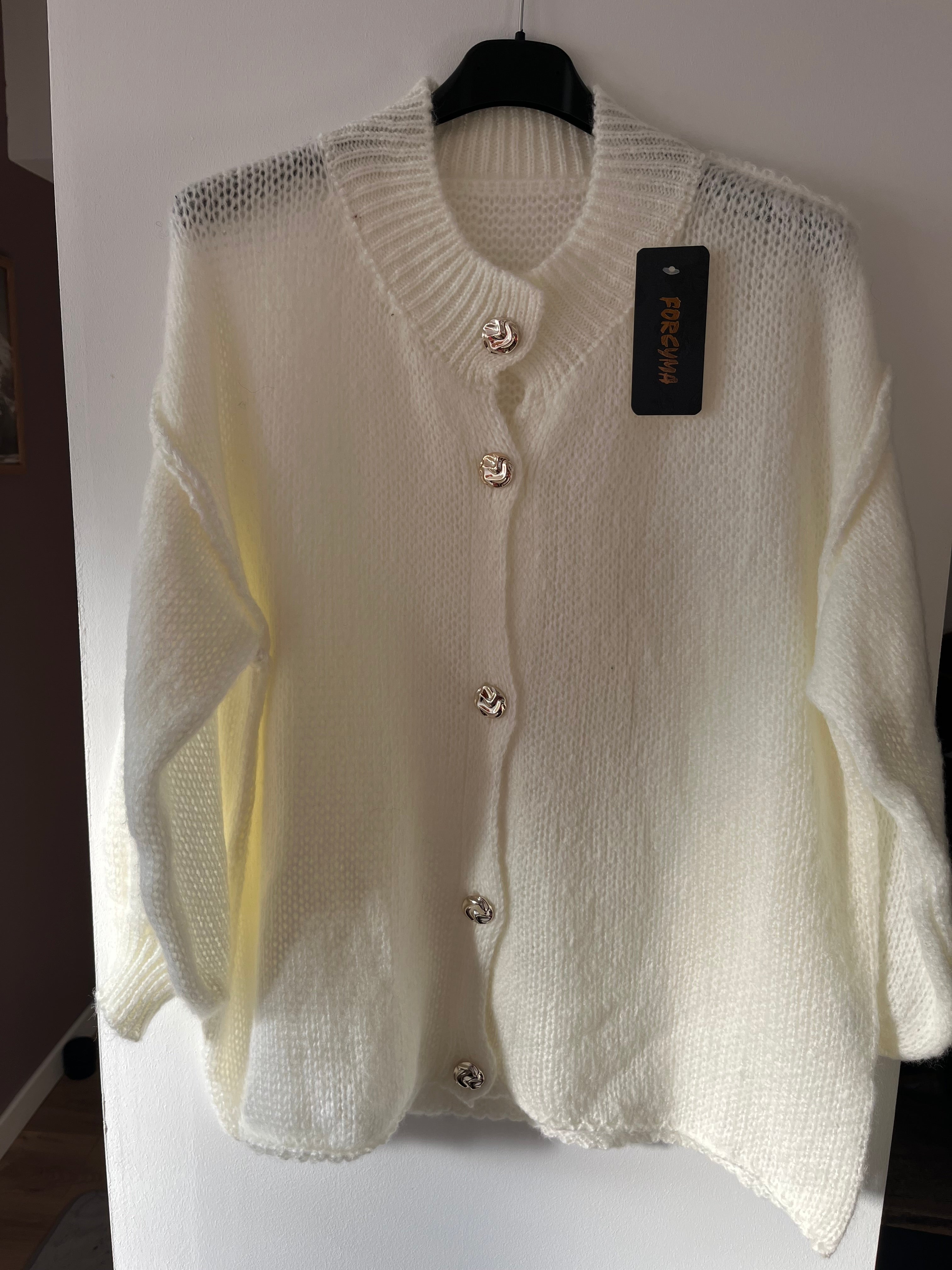 Gilet à col volanté et manches bouffantes